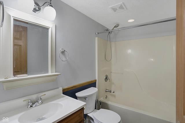 5371 Lue Ann Ln, Mooresville, IN 46158 - bathroom featuring a textured ceiling, visible vents, toilet, vanity, and shower / bathing tub combination