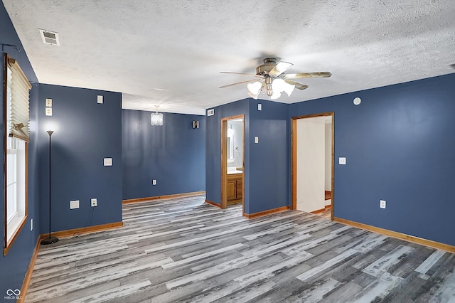 5371 Lue Ann Ln, Mooresville, IN 46158 - unfurnished room featuring a ceiling fan, wood finished floors, a textured ceiling, and visible vents