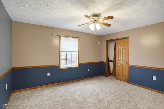 5371 Lue Ann Ln, Mooresville, IN 46158 - carpeted empty room with a textured ceiling, baseboards, and ceiling fan