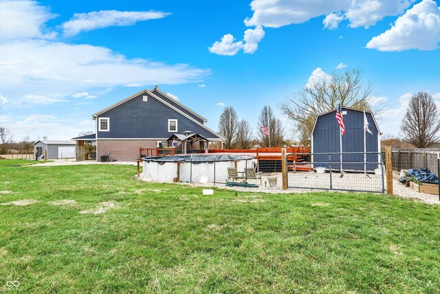 5371 Lue Ann Ln, Mooresville, IN 46158 - view of yard with a fenced in pool, an outbuilding, and fence