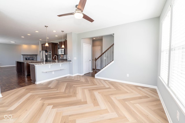 2314 Angelina Way, Greenwood, IN 46143 - interior space with a kitchen bar, plenty of natural light, stainless steel appliances, and ceiling fan