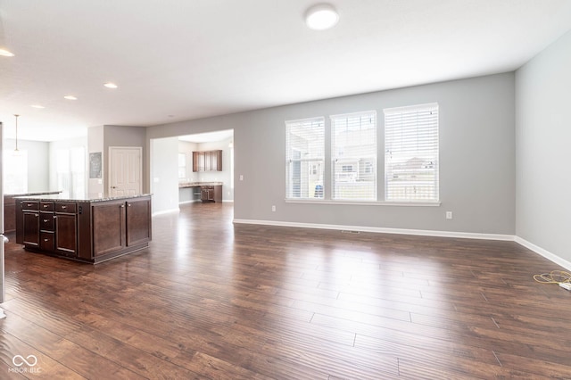 2314 Angelina Way, Greenwood, IN 46143 - unfurnished living room with baseboards, recessed lighting, and dark wood-style flooring