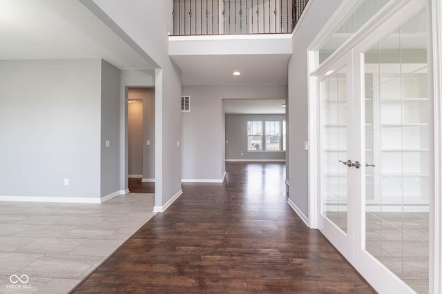 2314 Angelina Way, Greenwood, IN 46143 - corridor featuring baseboards, a high ceiling, wood finished floors, and french doors