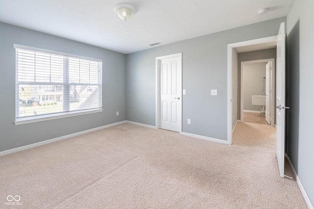 2314 Angelina Way, Greenwood, IN 46143 - unfurnished bedroom featuring baseboards, light colored carpet, and visible vents