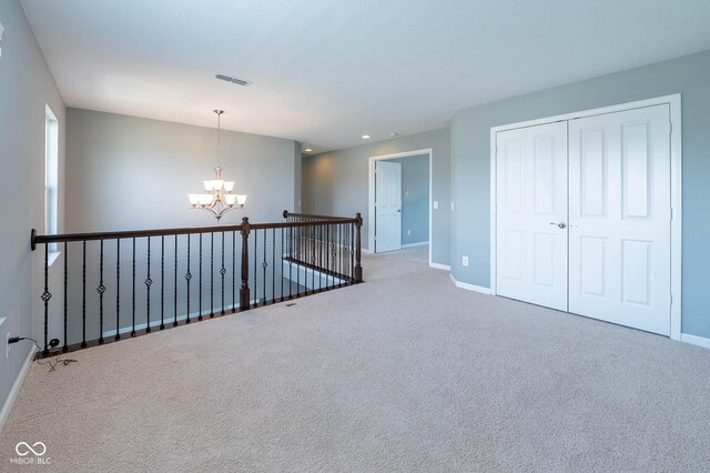 2314 Angelina Way, Greenwood, IN 46143 - hall with carpet flooring, visible vents, baseboards, recessed lighting, and an inviting chandelier