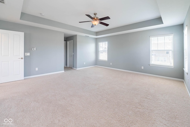 2314 Angelina Way, Greenwood, IN 46143 - unfurnished room with baseboards, ceiling fan, light carpet, and a raised ceiling
