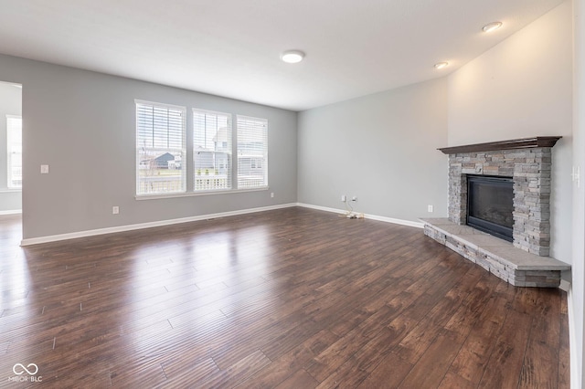 2314 Angelina Way, Greenwood, IN 46143 - unfurnished living room with dark wood-type flooring, baseboards, and a fireplace