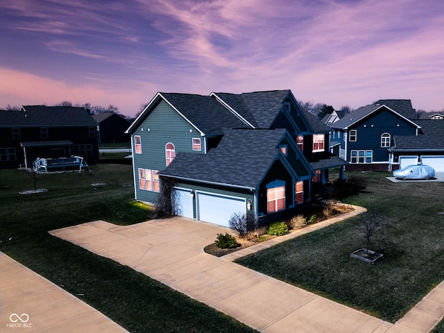 2314 Angelina Way, Greenwood, IN 46143 - view of front of home featuring driveway, roof with shingles, an attached garage, and a yard