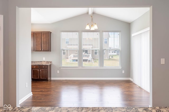 2314 Angelina Way, Greenwood, IN 46143 - unfurnished dining area featuring lofted ceiling with beams, dark wood-style flooring, a notable chandelier, and baseboards