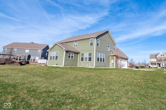2314 Angelina Way, Greenwood, IN 46143 - back of house with an attached garage and a yard