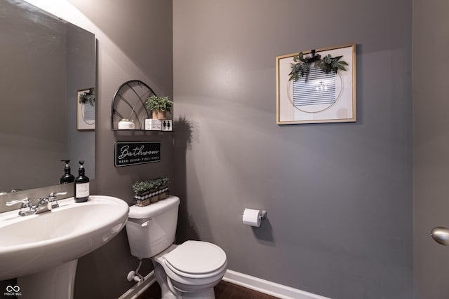 12959 Balfour Rd, Fishers, IN 46037 - half bath featuring toilet, a sink, and baseboards