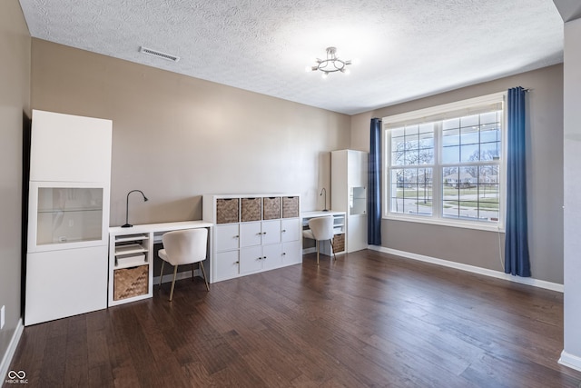 12959 Balfour Rd, Fishers, IN 46037 - office with wood finished floors, baseboards, and a textured ceiling