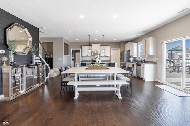 12959 Balfour Rd, Fishers, IN 46037 - dining space featuring stairs, dark wood-style floors, recessed lighting, and baseboards