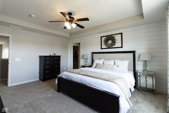 12959 Balfour Rd, Fishers, IN 46037 - bedroom with light carpet, a ceiling fan, a raised ceiling, and baseboards