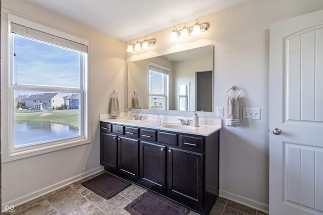 12959 Balfour Rd, Fishers, IN 46037 - bathroom featuring double vanity and baseboards