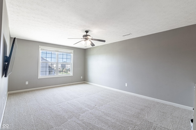 12959 Balfour Rd, Fishers, IN 46037 - carpeted empty room featuring ceiling fan, baseboards, and a textured ceiling