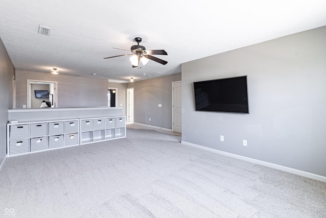 12959 Balfour Rd, Fishers, IN 46037 - unfurnished living room featuring baseboards, light colored carpet, and ceiling fan