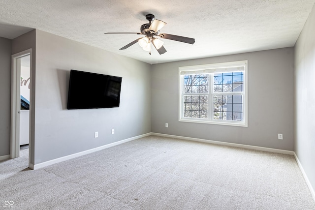 12959 Balfour Rd, Fishers, IN 46037 - spare room with carpet floors, a textured ceiling, baseboards, and ceiling fan