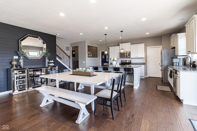 12959 Balfour Rd, Fishers, IN 46037 - dining area with stairs, dark wood finished floors, and recessed lighting