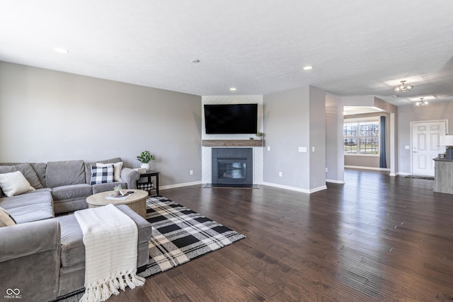 12959 Balfour Rd, Fishers, IN 46037 - living room featuring dark wood-style floors, baseboards, a fireplace, and recessed lighting