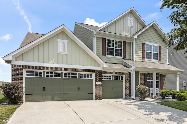 12959 Balfour Rd, Fishers, IN 46037 - view of front of house featuring board and batten siding, driveway, brick siding, roof with shingles, and covered porch