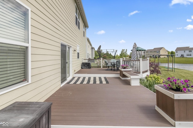 12959 Balfour Rd, Fishers, IN 46037 - wooden terrace featuring outdoor dining space, a water view, and a residential view