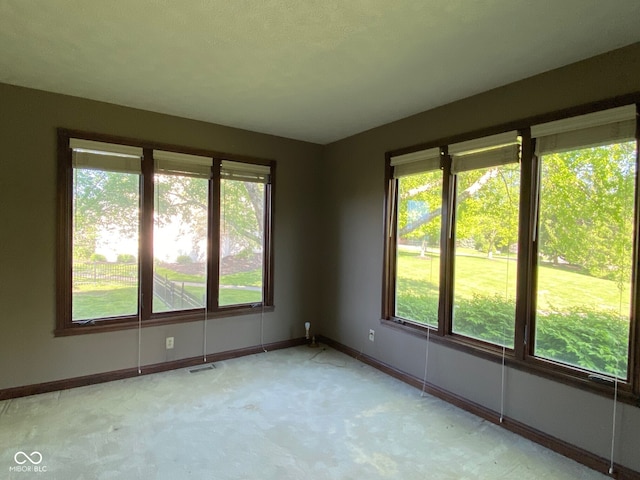11967 Windpointe Pass, Carmel, IN 46033 - empty room with plenty of natural light, light colored carpet, and baseboards