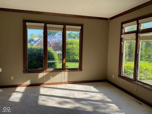 11967 Windpointe Pass, Carmel, IN 46033 - empty room with light carpet, baseboards, healthy amount of natural light, and crown molding