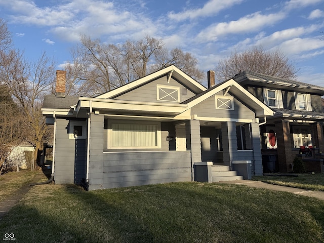 1124 Victory Ct, Anderson, IN 46016 - view of front facade with a front lawn and a chimney
