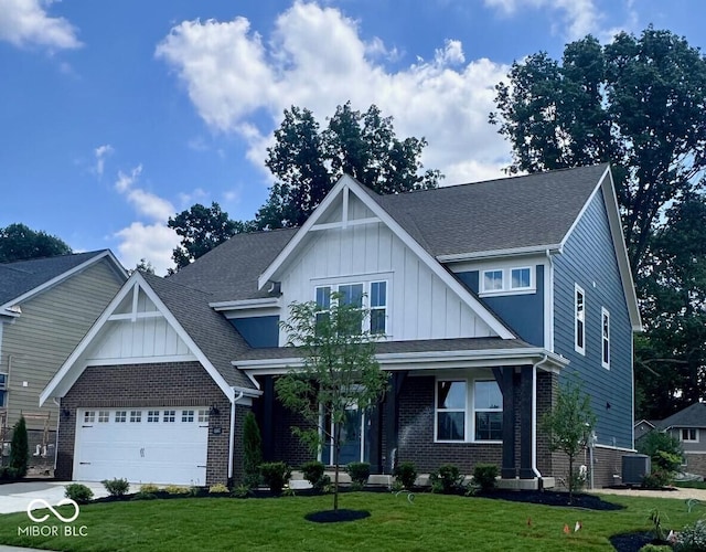 6887 Oakdale Ln, Avon, IN 46123 - view of front of property featuring board and batten siding, brick siding, and a front yard