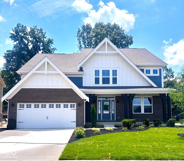 6887 Oakdale Ln, Avon, IN 46123 - view of front facade with board and batten siding, driveway, a front lawn, and brick siding