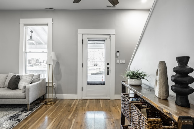 1665 N College Ave, Indianapolis, IN 46202 - foyer entrance featuring wood-type flooring, ceiling fan, and baseboards