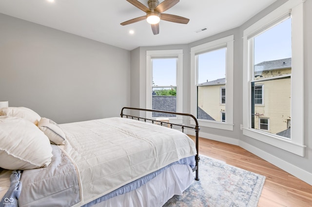 1665 N College Ave, Indianapolis, IN 46202 - bedroom with recessed lighting, baseboards, wood finished floors, and ceiling fan
