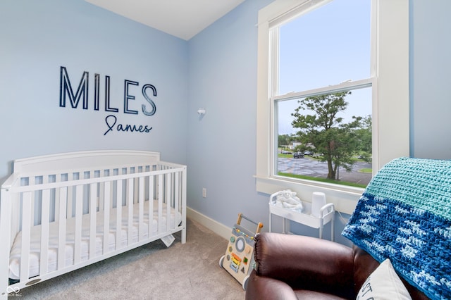 1665 N College Ave, Indianapolis, IN 46202 - bedroom with multiple windows, carpet, a nursery area, and baseboards