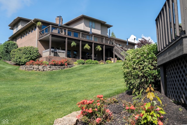 9398 W Mirror Rd, Columbus, IN 47201 - back of house with a chimney, a yard, a balcony, and stairway