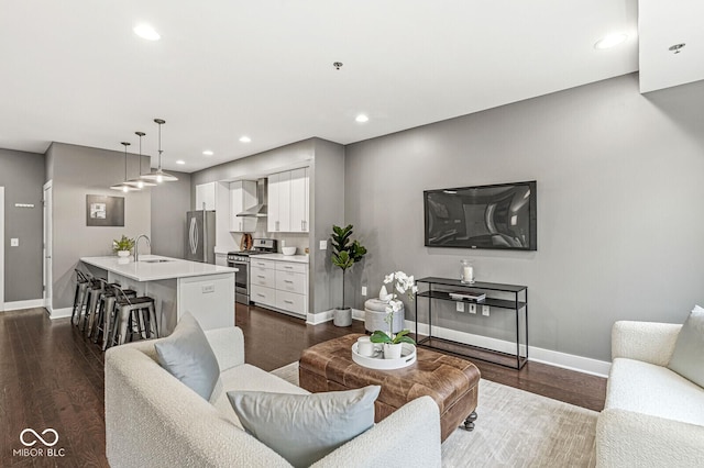 622 E 10th St Unit 206, Indianapolis, IN 46202 - living area with baseboards, dark wood-style floors, and recessed lighting