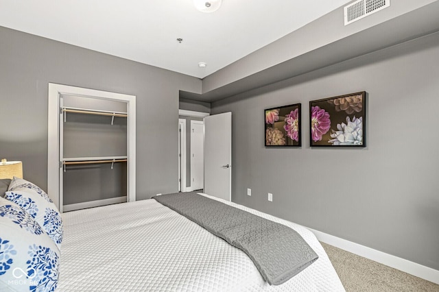 622 E 10th St Unit 206, Indianapolis, IN 46202 - unfurnished bedroom featuring carpet flooring, baseboards, and a closet