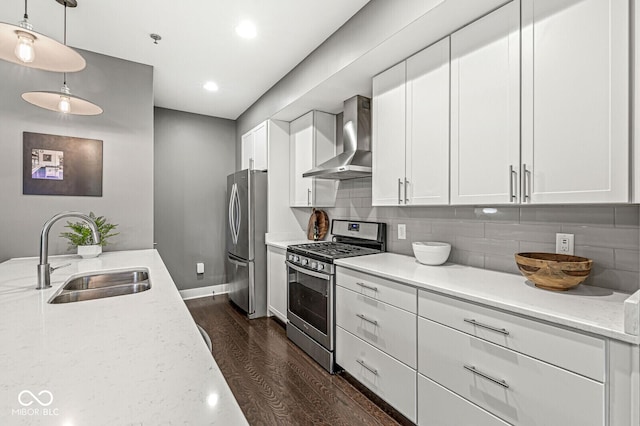 622 E 10th St Unit 206, Indianapolis, IN 46202 - kitchen with stainless steel appliances, a sink, wall chimney range hood, dark wood-type flooring, and white cabinets