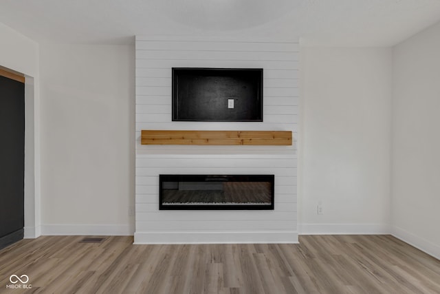 843 N Oxford St, Indianapolis, IN 46201 - detailed view of a fireplace and wood finished floors