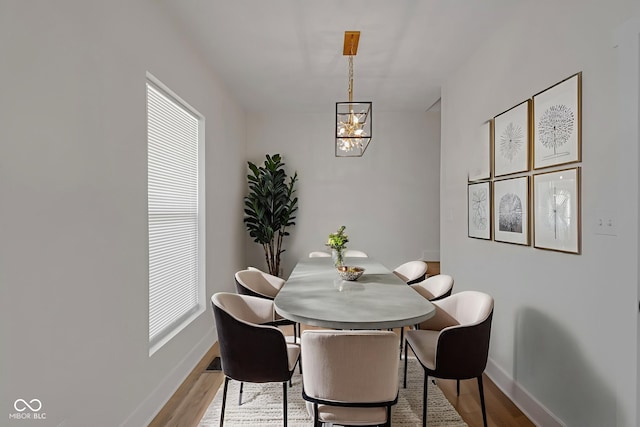 843 N Oxford St, Indianapolis, IN 46201 - dining space with a chandelier and wood finished floors