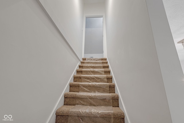 843 N Oxford St, Indianapolis, IN 46201 - staircase featuring baseboards