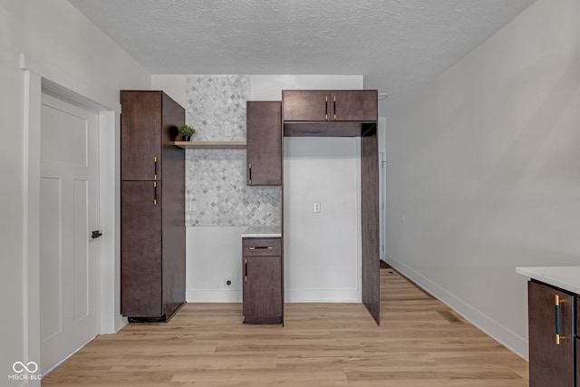 843 N Oxford St, Indianapolis, IN 46201 - unfurnished bedroom with light wood-style floors and a textured ceiling