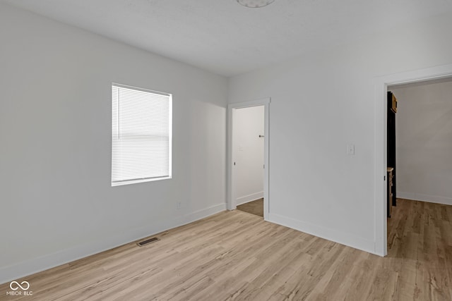 843 N Oxford St, Indianapolis, IN 46201 - empty room with light wood finished floors and baseboards