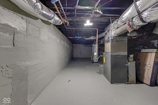 843 N Oxford St, Indianapolis, IN 46201 - unfinished basement featuring water heater and heating unit