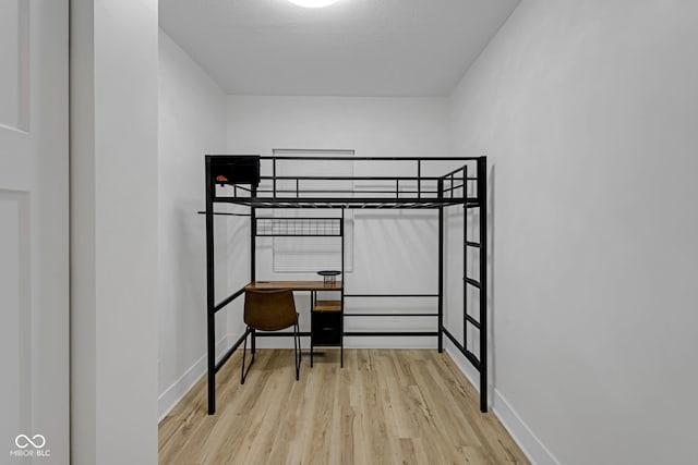 843 N Oxford St, Indianapolis, IN 46201 - bedroom featuring wood finished floors and baseboards