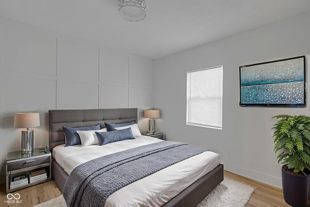 843 N Oxford St, Indianapolis, IN 46201 - bedroom with light wood-style floors and baseboards