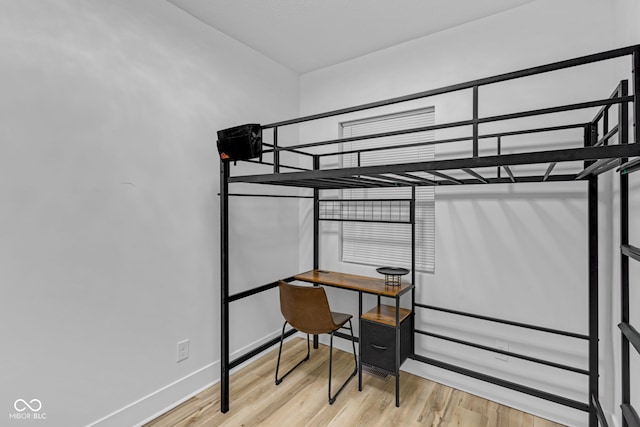 843 N Oxford St, Indianapolis, IN 46201 - bedroom with wood finished floors and baseboards