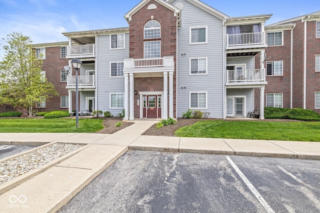6231 Amber Creek Ln Unit 312, Indianapolis, IN 46237 - view of property featuring uncovered parking