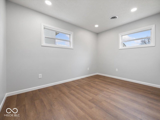 329 Roosevelt Dr, Shelbyville, IN 46176 - unfurnished room featuring visible vents, baseboards, and wood finished floors