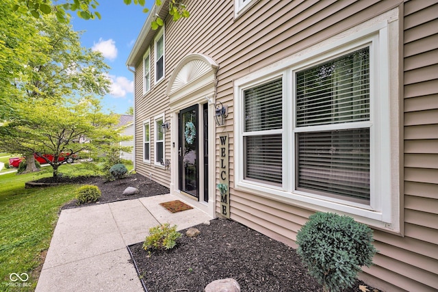7383 Poppyseed Dr, Indianapolis, IN 46237 - view of exterior entry featuring a yard